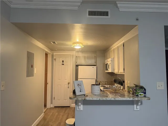 a kitchen with a refrigerator stove and sink