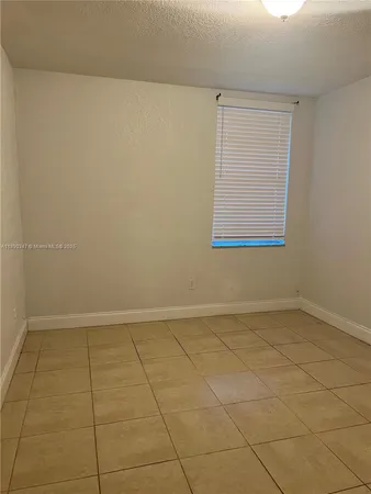 an empty room with a bench
