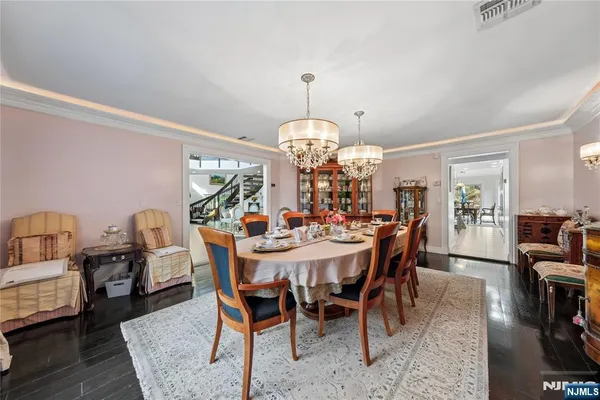 a bathroom with a granite countertop sink a toilet a mirror and shower