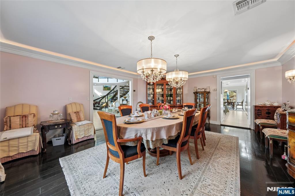 93 Jackson Drive Cresskill, NJ 07626 - Photo 15 of 37 a view of a dining room with furniture and wooden floor