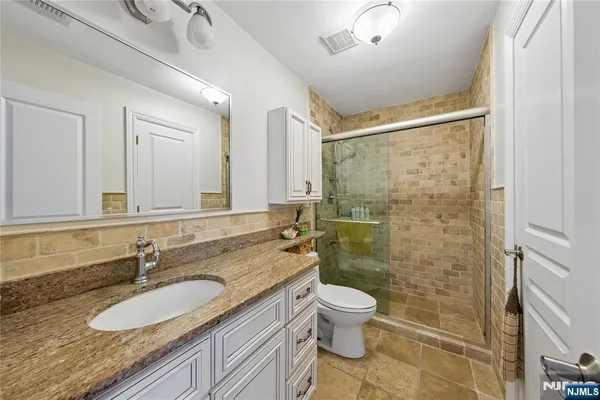 a living room with lots of furniture and wooden floor