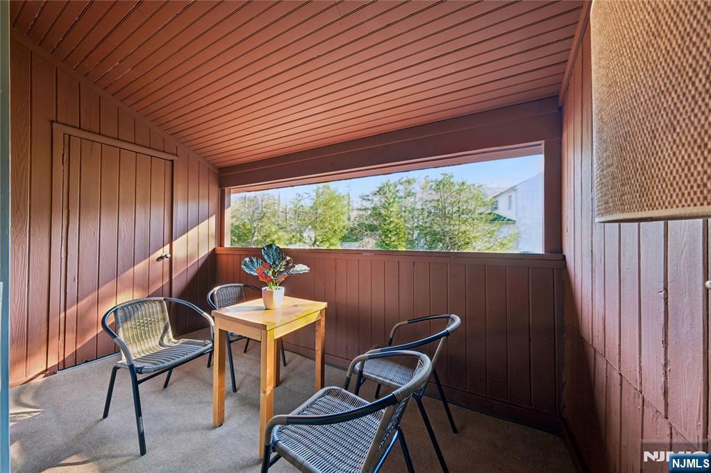 93 Jackson Drive Cresskill, NJ 07626 - Photo 22 of 37 a balcony with table and chairs