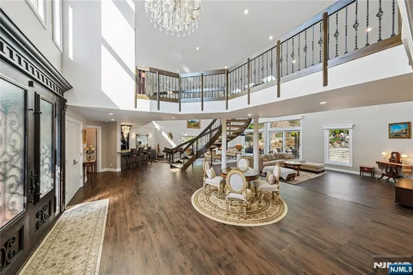 a living room with lots of furniture and kitchen view