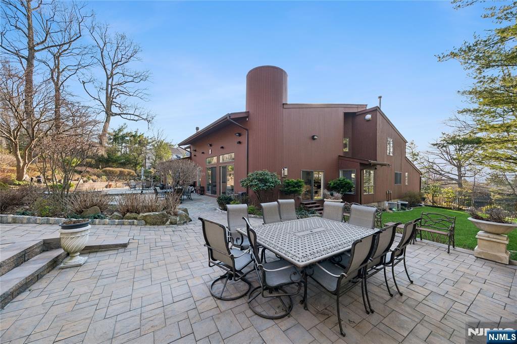 93 Jackson Drive Cresskill, NJ 07626 - Photo 32 of 37 a view of backyard with outdoor seating a patio and plants