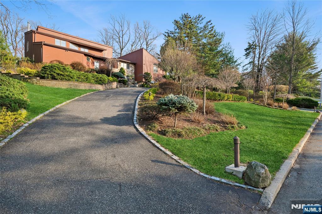 93 Jackson Drive Cresskill, NJ 07626 - Photo 36 of 37 a front view of a house with a yard