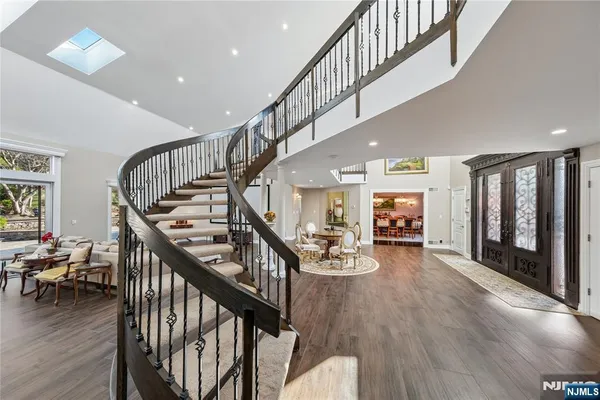 a living room with furniture fireplace and a large window