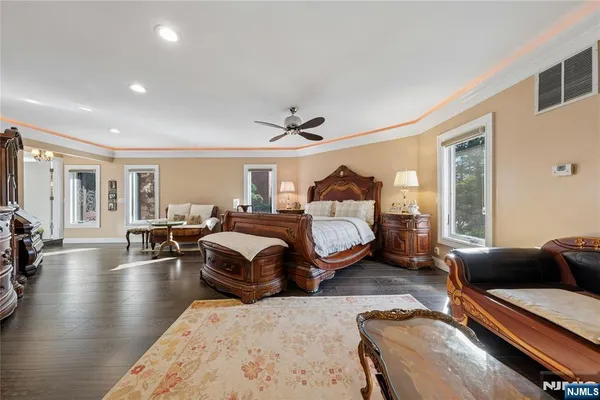 a bathroom with a bathtub and a large window