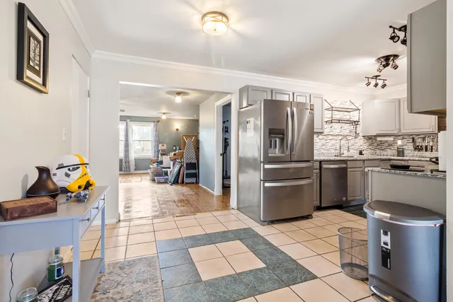 a kitchen with a sink appliances and cabinets