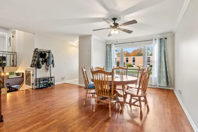 a view of a dining room with furniture and wooden floor