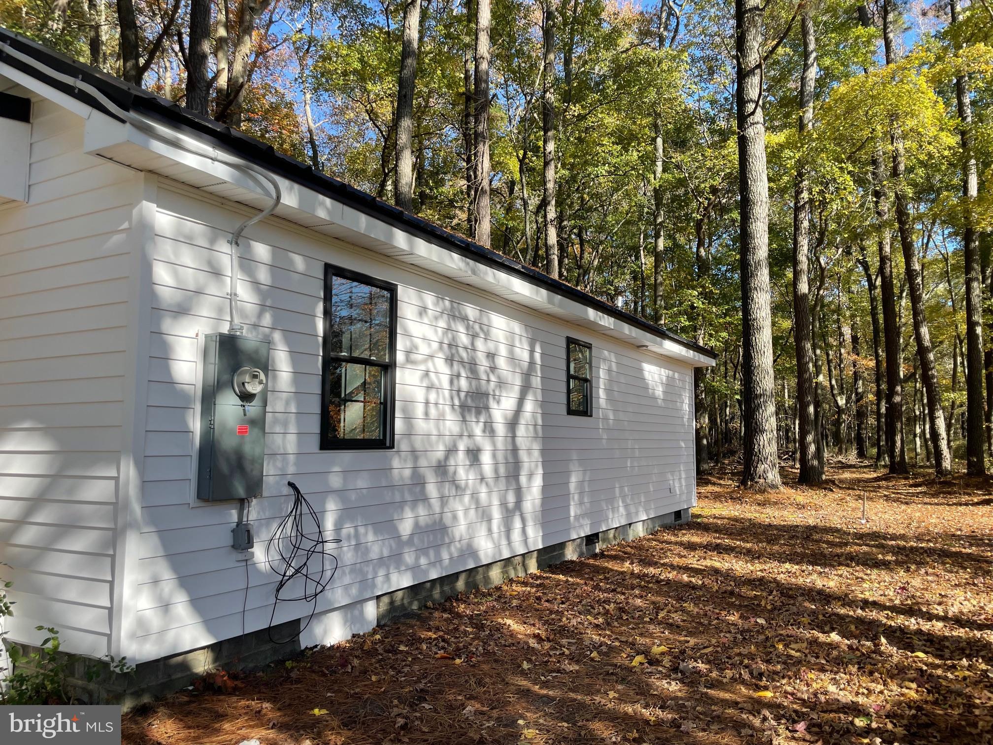 5051 Wayman Road Marion Station, MD 21838 - Photo 2 of 13 a front view of a house with trees