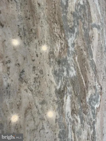 a close up of a white marble wall