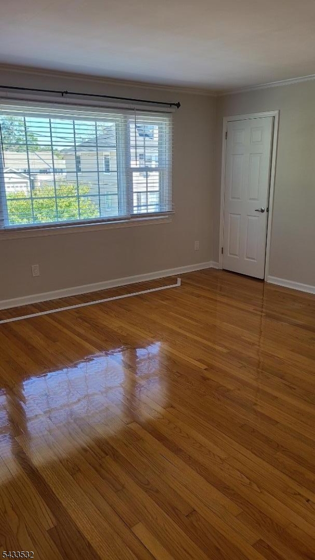 16 Ocean Street Millburn, NJ 07041 - Photo 9 of 26 an empty room with wooden floor and windows