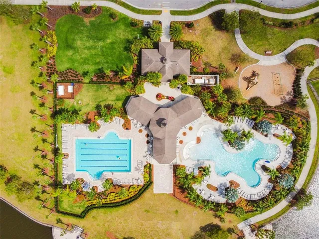 a view of a swimming pool with a yard