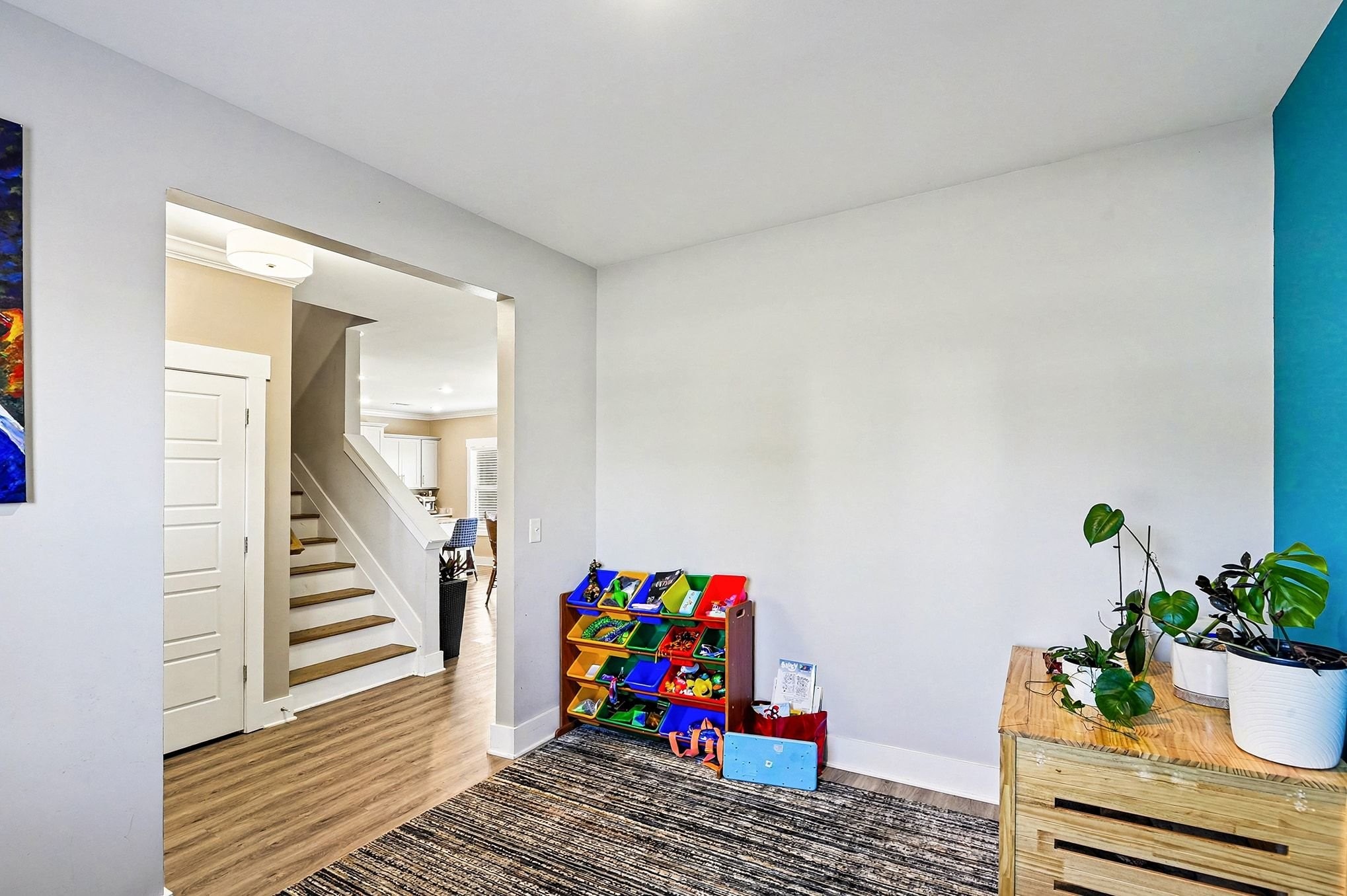 616 Bella Court Lebanon, TN 37087 - Photo 5 of 32 a living room with furniture stairs and a potted plant