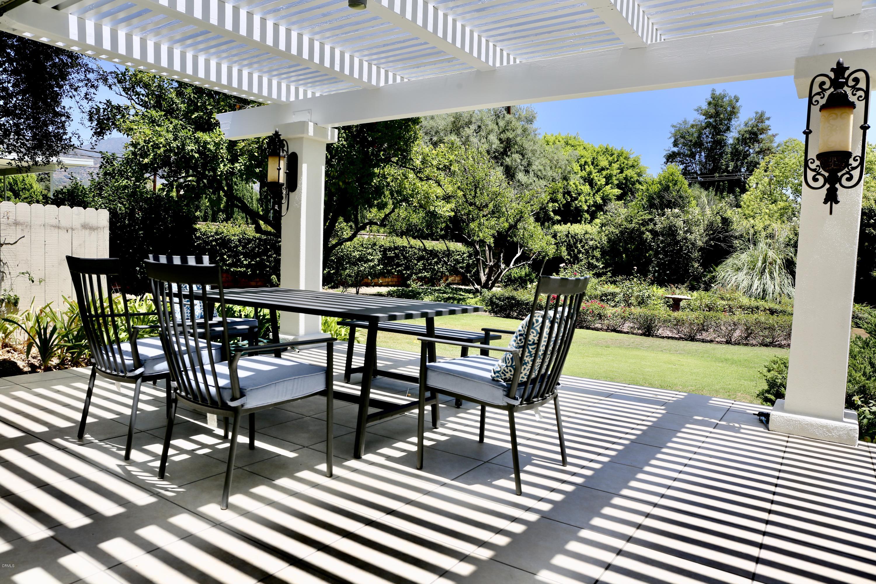 1518 Rodeo Road Arcadia, CA 91006 - Photo 13 of 30 a view of a chairs and table in patio with wooden floor
