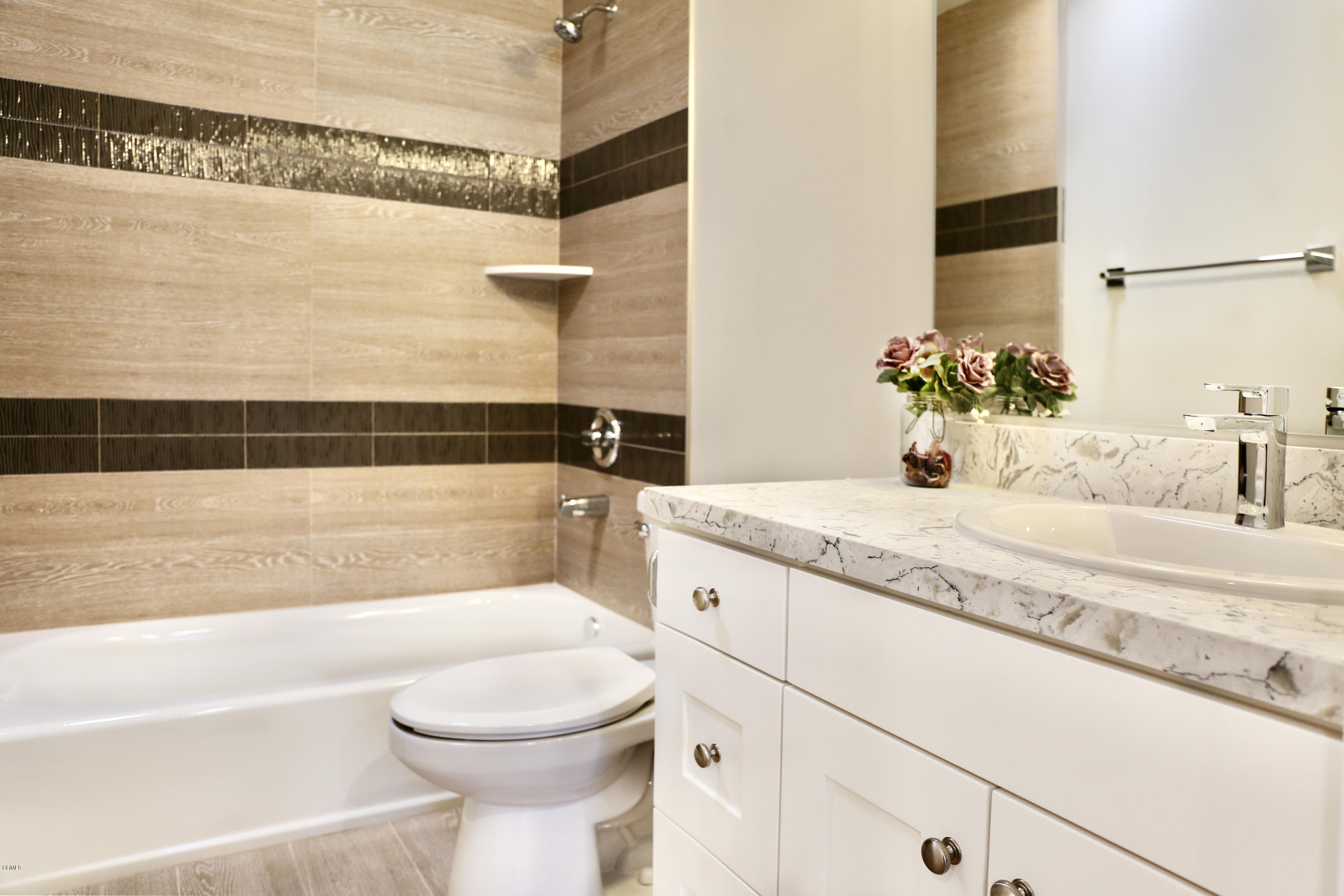 1518 Rodeo Road Arcadia, CA 91006 - Photo 16 of 30 a bathroom with a granite countertop sink a toilet and bathtub