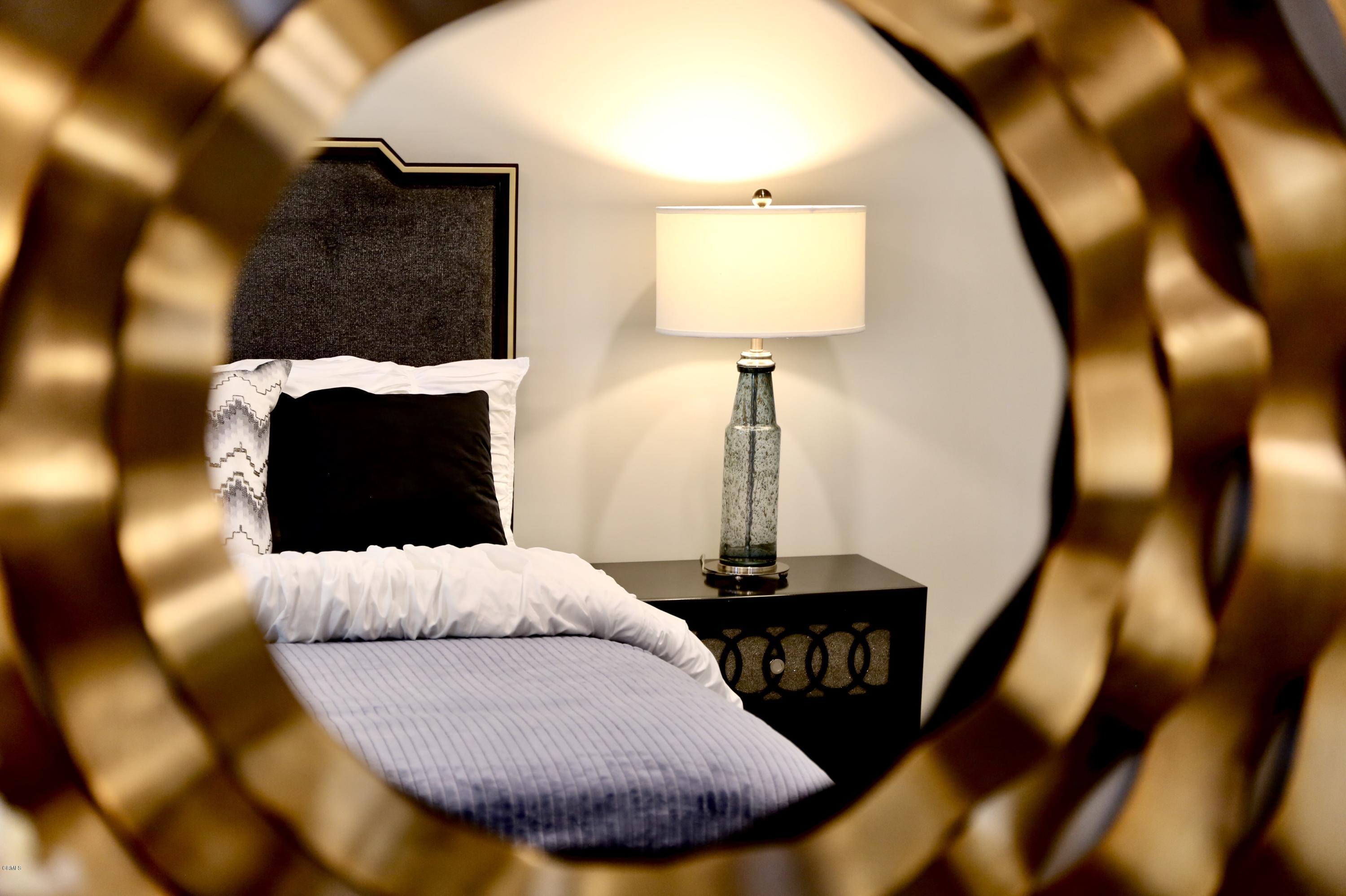 1518 Rodeo Road Arcadia, CA 91006 - Photo 22 of 30 a bed sitting in a bedroom next to a lamp