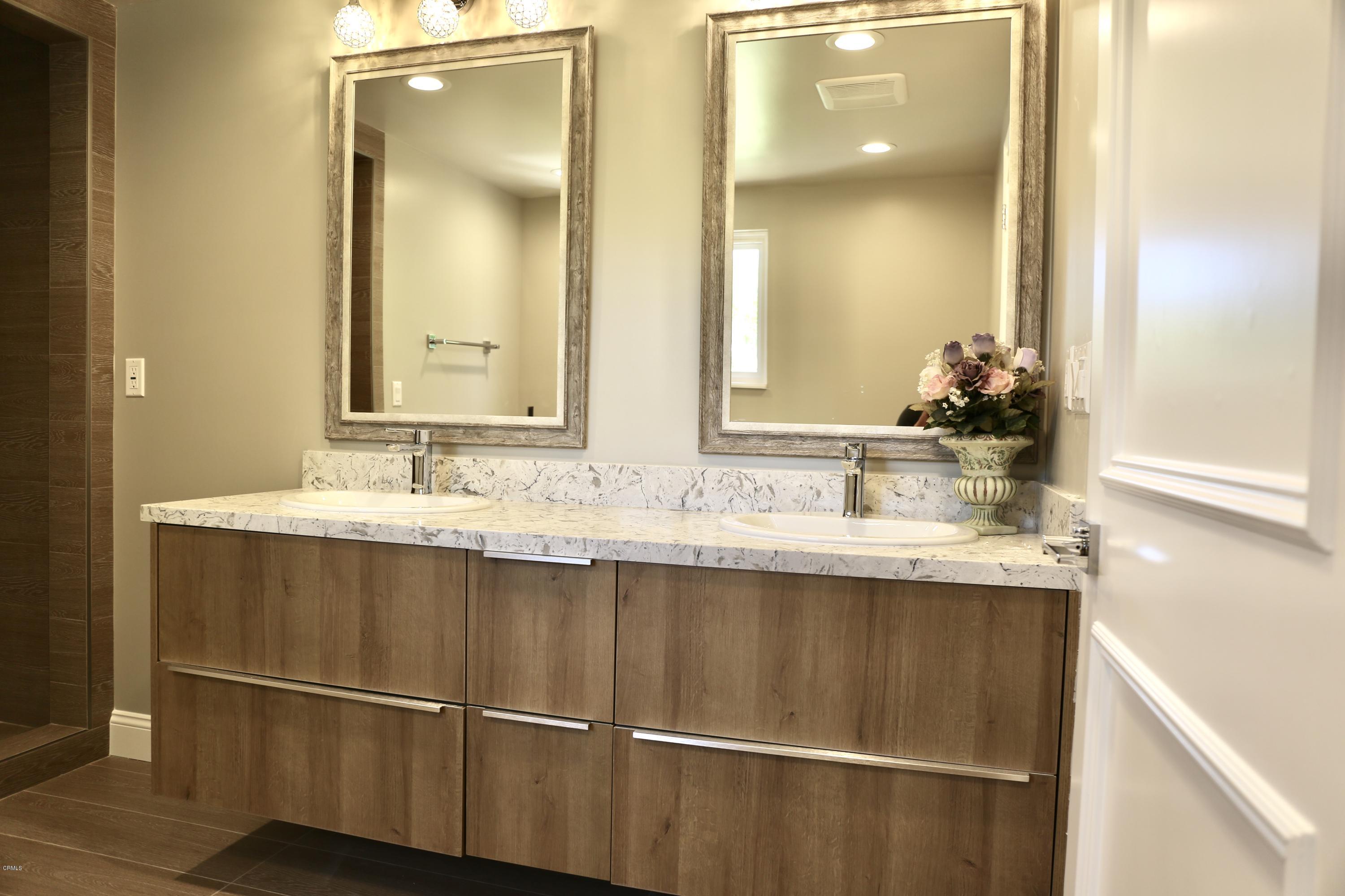 1518 Rodeo Road Arcadia, CA 91006 - Photo 23 of 30 a bathroom with a sink and a mirror