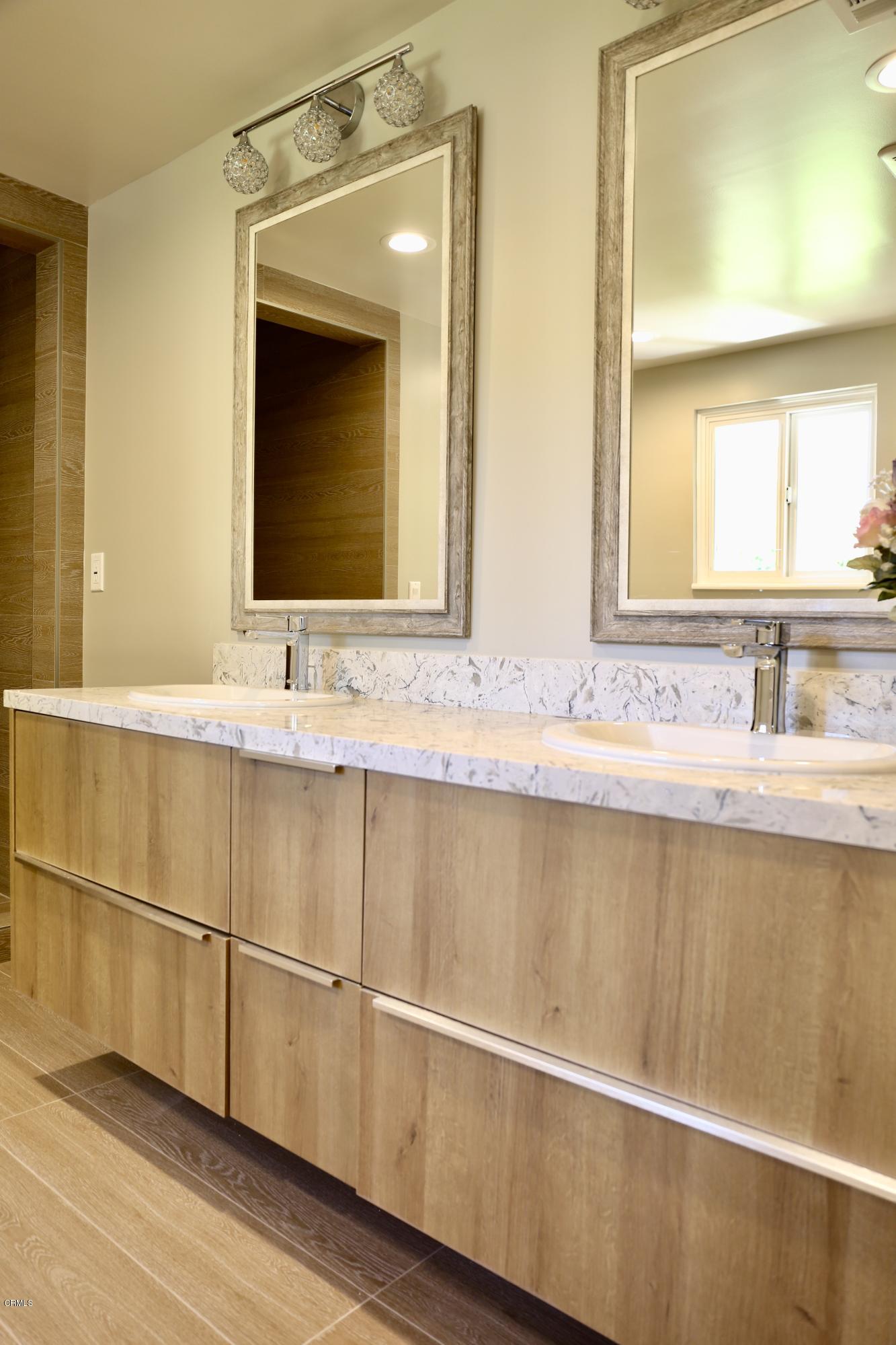 1518 Rodeo Road Arcadia, CA 91006 - Photo 24 of 30 a bathroom with a sink and a mirror