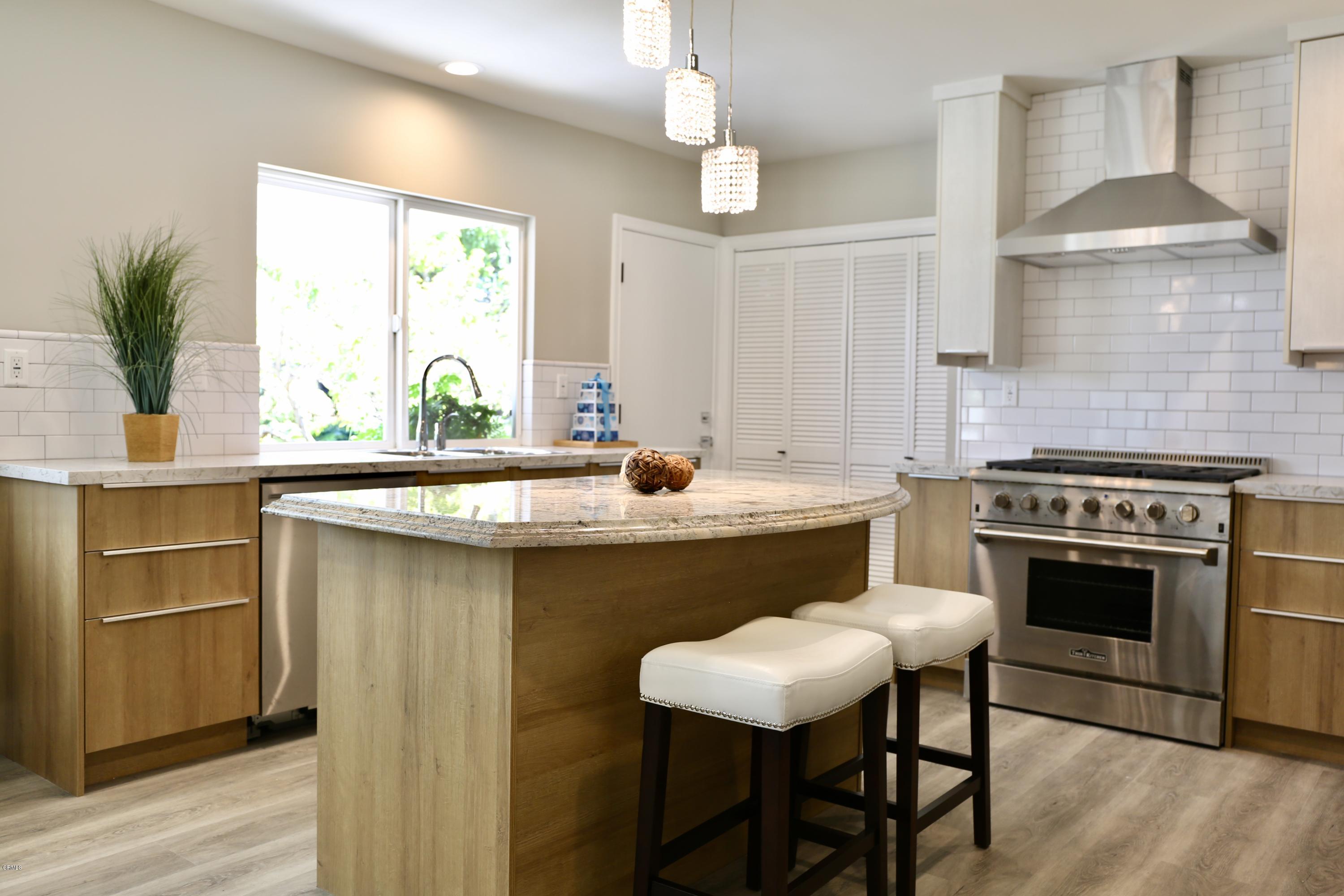1518 Rodeo Road Arcadia, CA 91006 - Photo 8 of 30 a kitchen with a stove a sink and a refrigerator