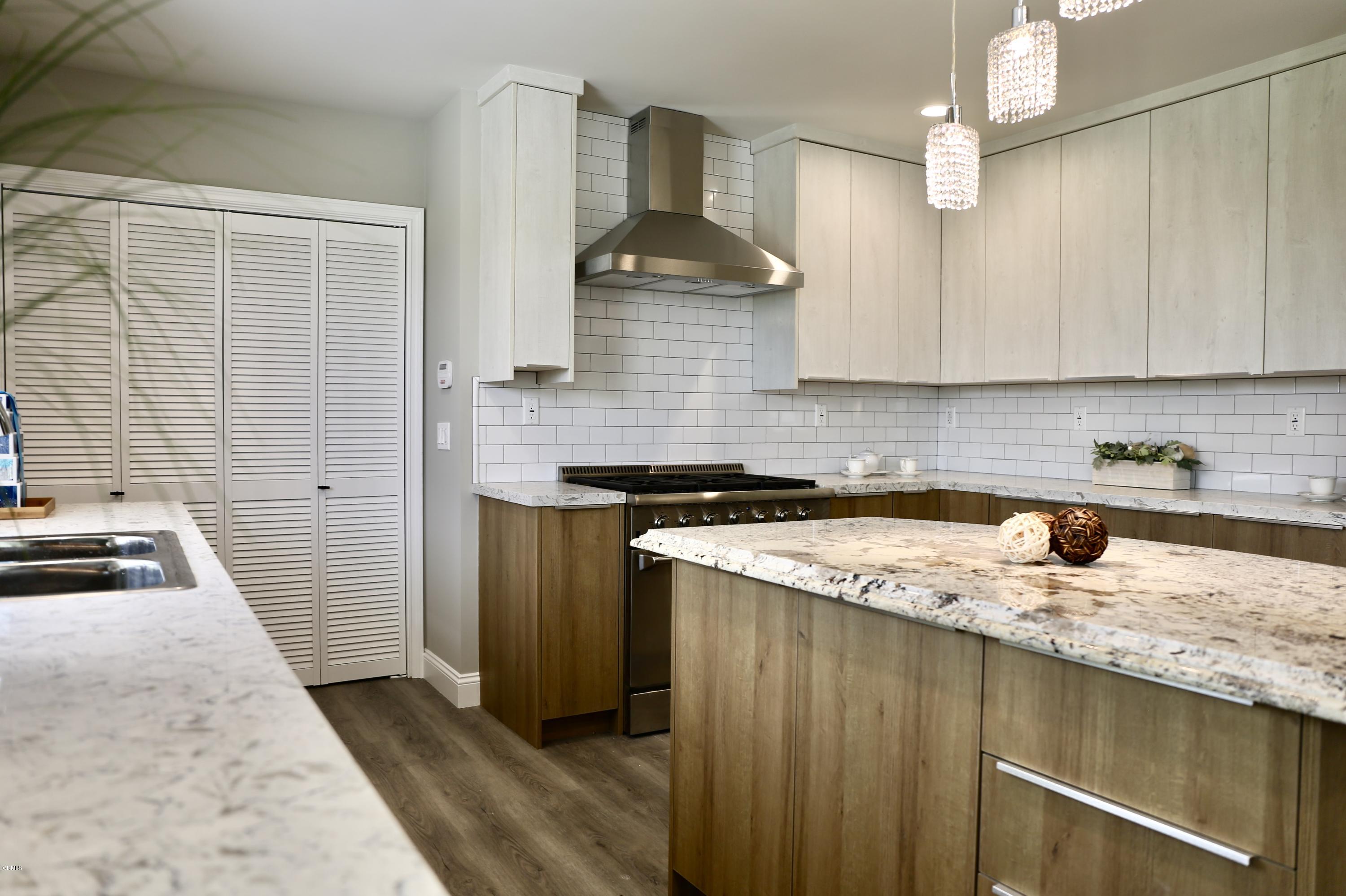 1518 Rodeo Road Arcadia, CA 91006 - Photo 10 of 30 a kitchen with stainless steel appliances granite countertop a sink stove and cabinets