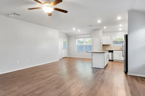 a view of kitchen with sink and wooden floor