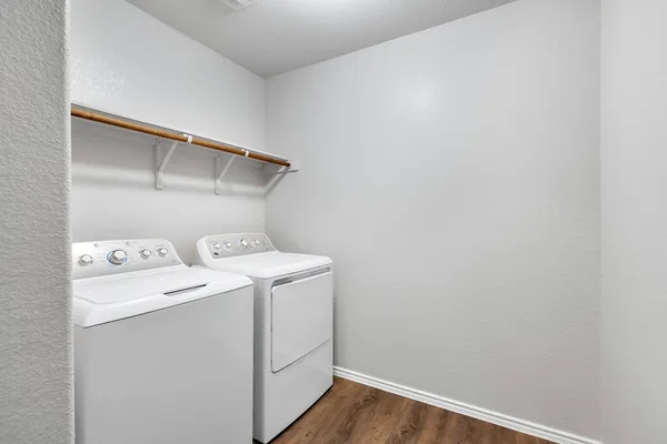 a utility room with dryer and washer