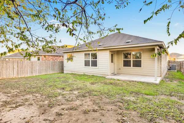 a house with trees in the background