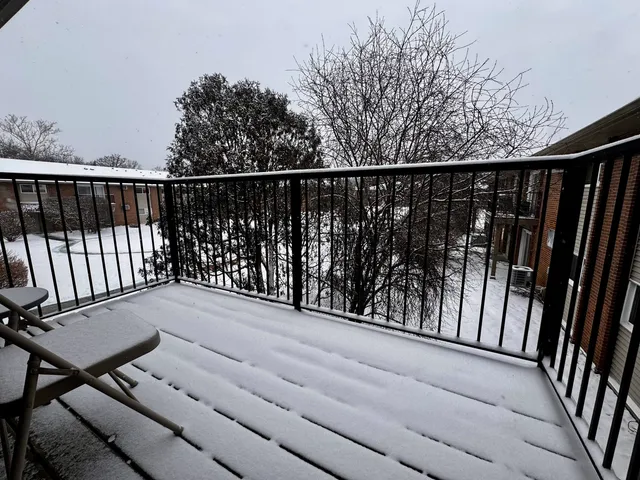 a balcony with wooden floor