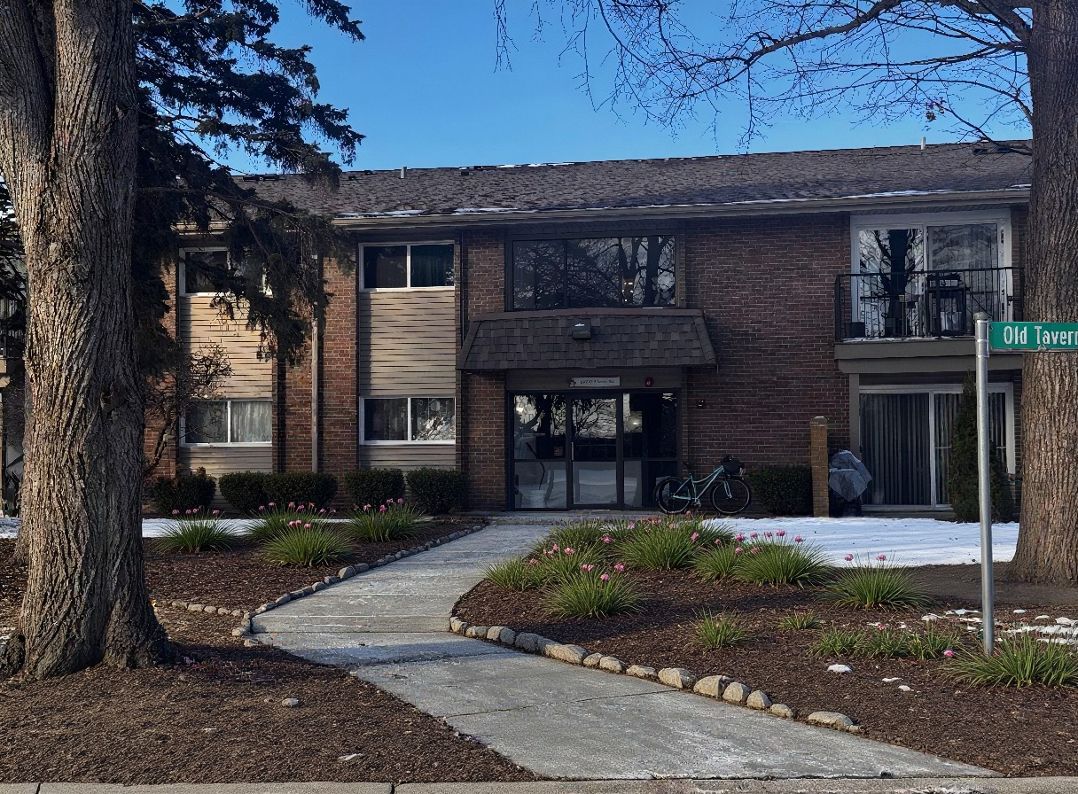 2300 Old Tavern Road, Unit 205 Lisle, IL 60532 - Photo 4 of 12 a front view of a house with a yard