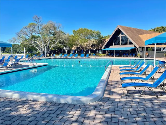 a view of a deck with a table and chairs