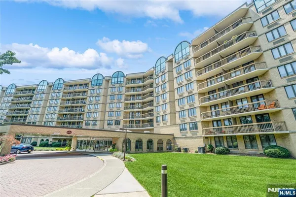 a view of big building with a yard