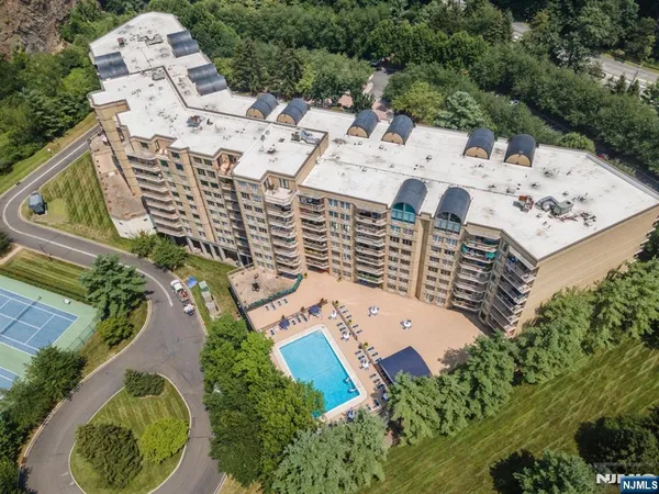 an aerial view of a multi story parking building