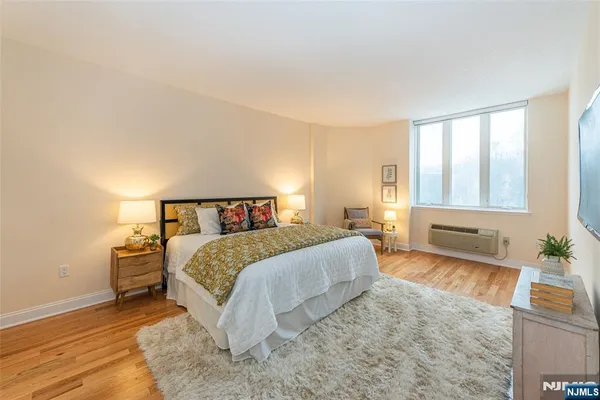 a bedroom with a bed and a couch