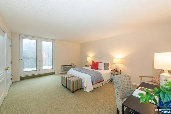 a bed room with a bed and a chair