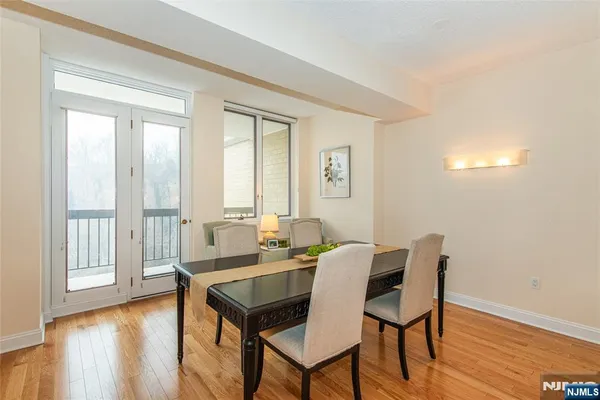 a view of a dining room with furniture wooden floor and a carpet