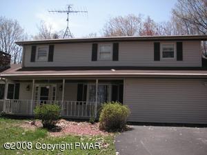 33 Old Timber Road Mount Pocono, PA 18344 - Photo 1 of 14 a front view of a house with a garden