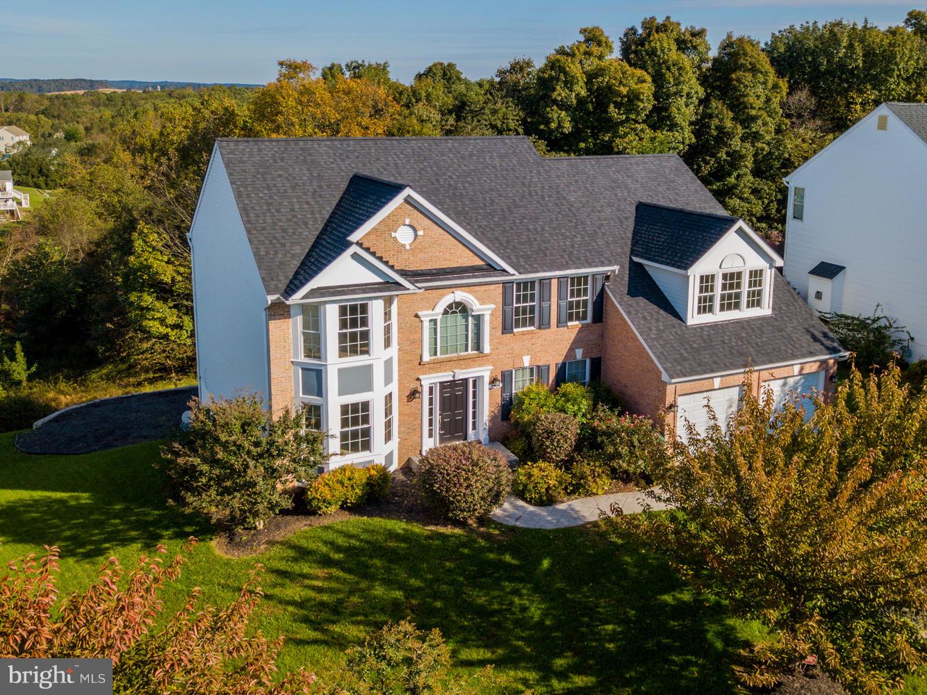 5986 Calvert Way Eldersburg, MD 21784 - Photo 1 of 40 a front view of a house with a yard