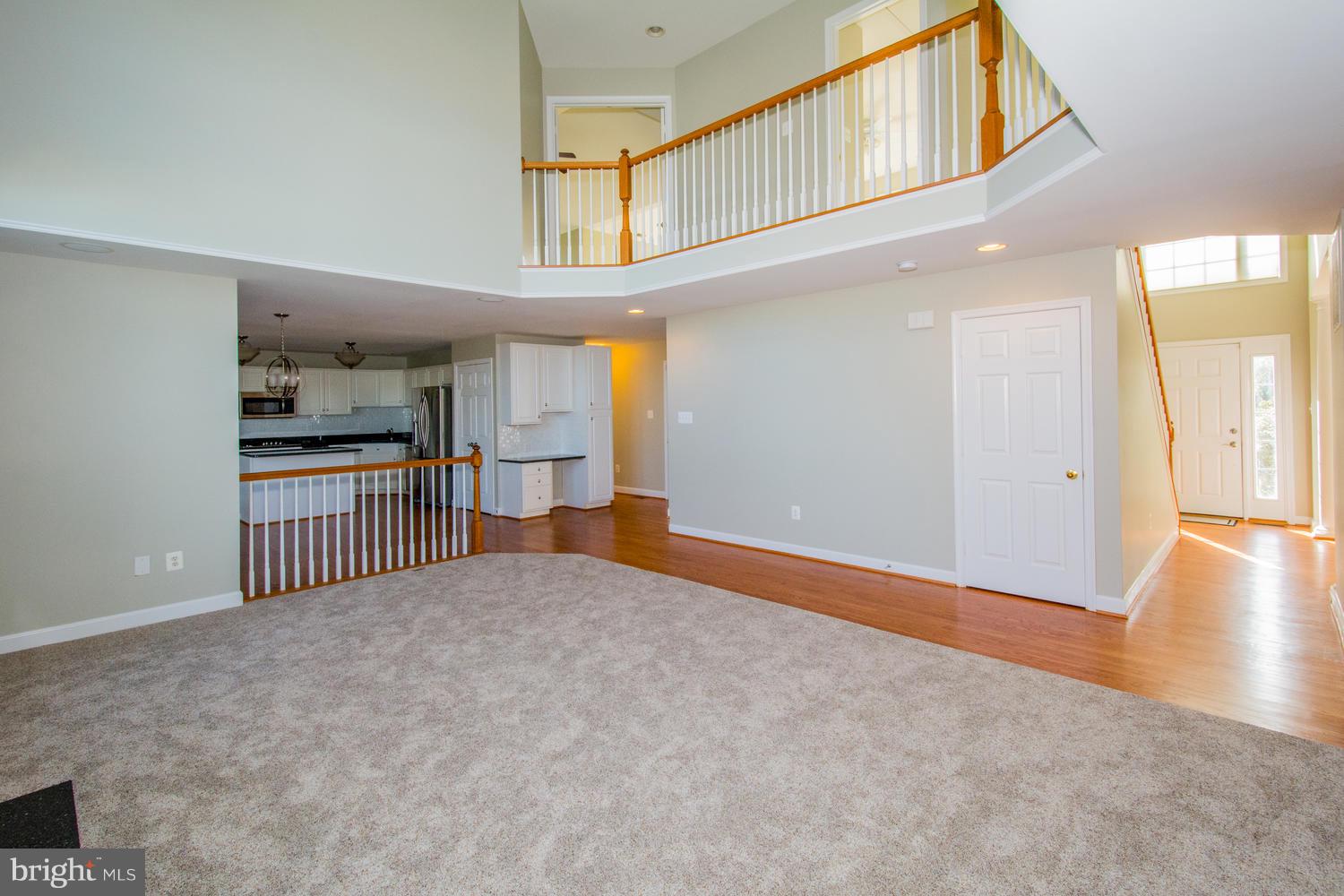 5986 Calvert Way Eldersburg, MD 21784 - Photo 11 of 40 a view of empty room with wooden floor