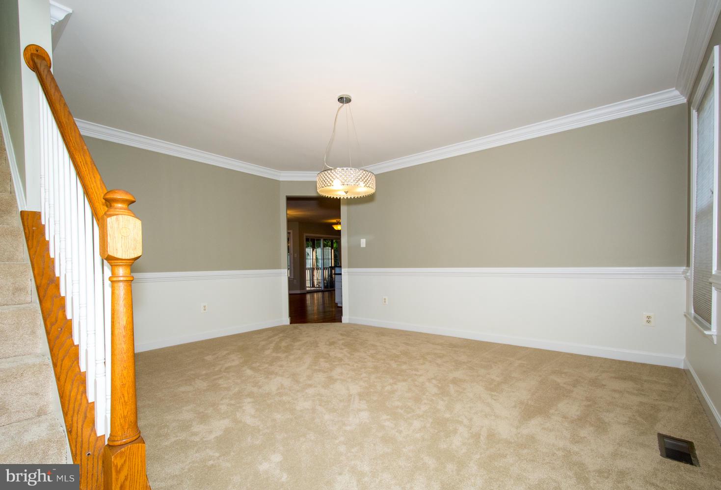 5986 Calvert Way Eldersburg, MD 21784 - Photo 15 of 40 a view of an empty room with wooden floor