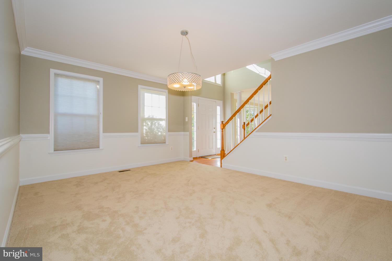 5986 Calvert Way Eldersburg, MD 21784 - Photo 16 of 40 a view of an empty room with wooden floor and a window