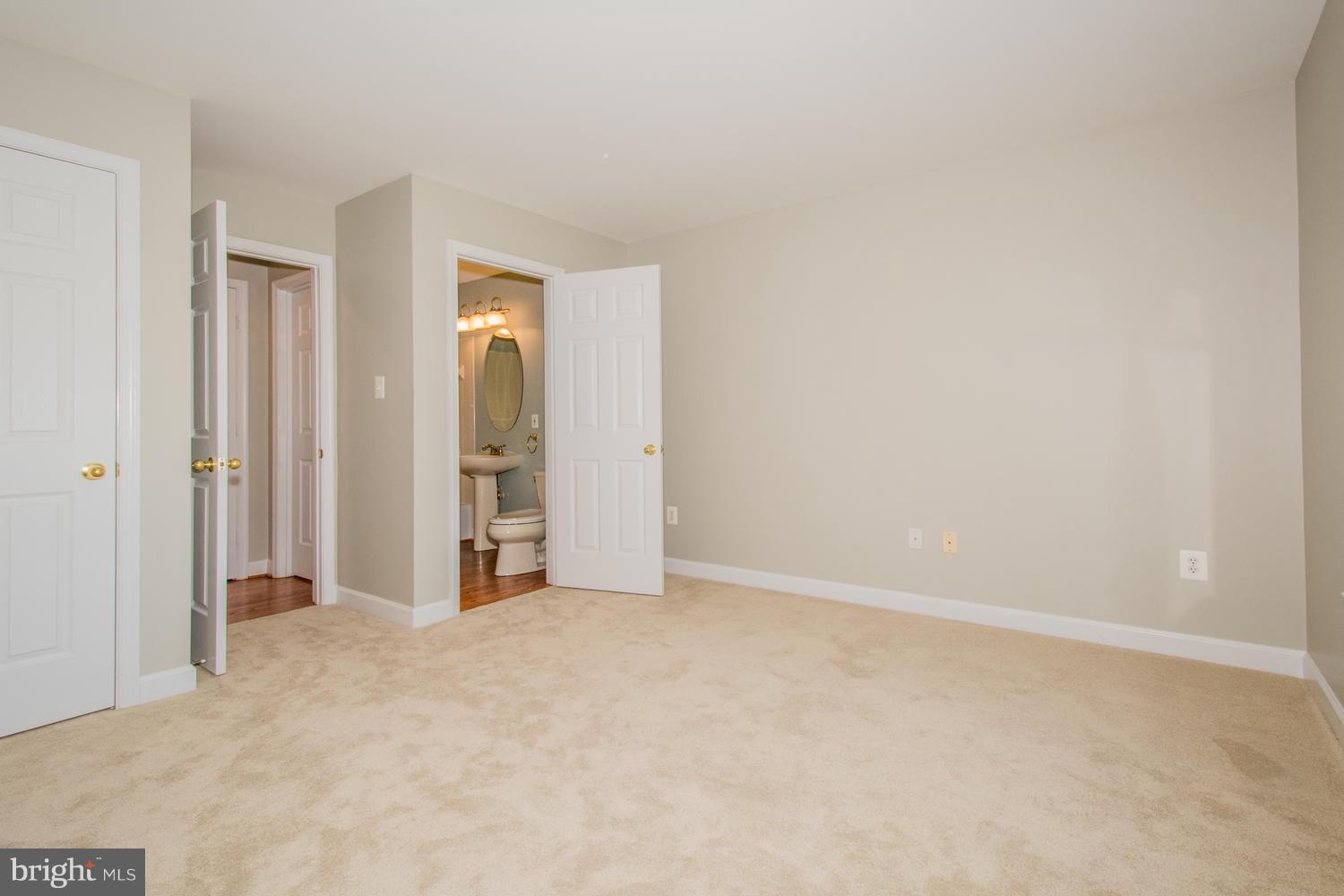 5986 Calvert Way Eldersburg, MD 21784 - Photo 18 of 40 an empty room with closet and mirror