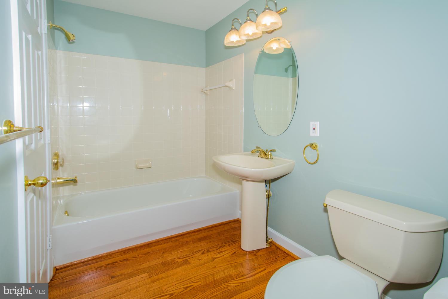 5986 Calvert Way Eldersburg, MD 21784 - Photo 19 of 40 a bathroom with a sink toilet and shower