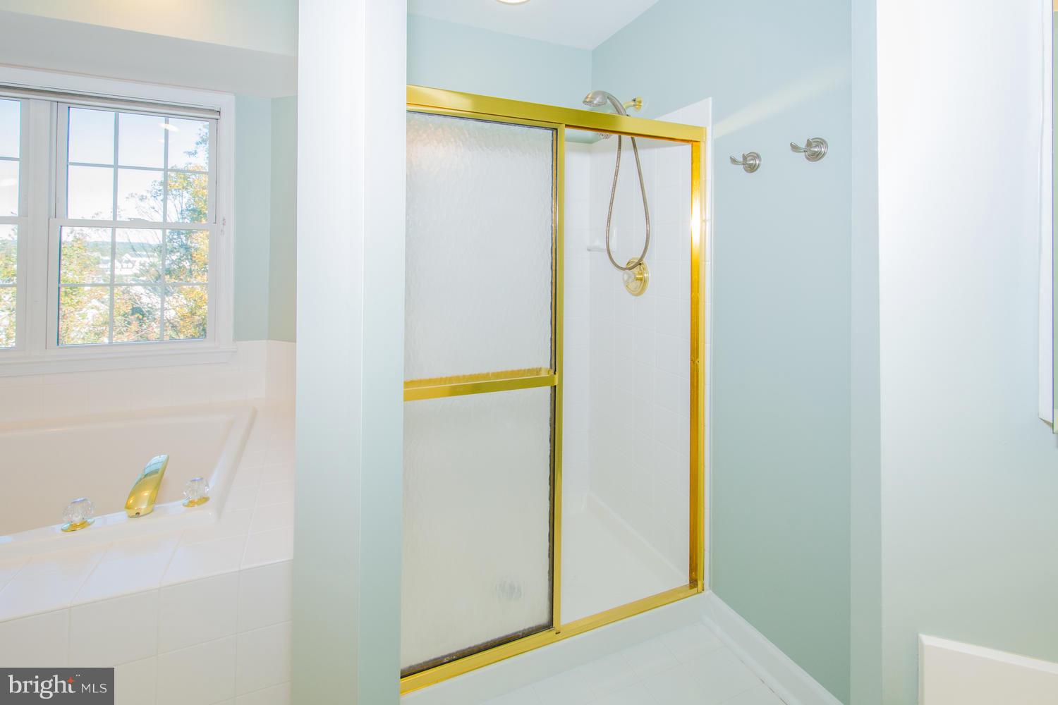 5986 Calvert Way Eldersburg, MD 21784 - Photo 27 of 40 a bathroom with a bathtub and a shower