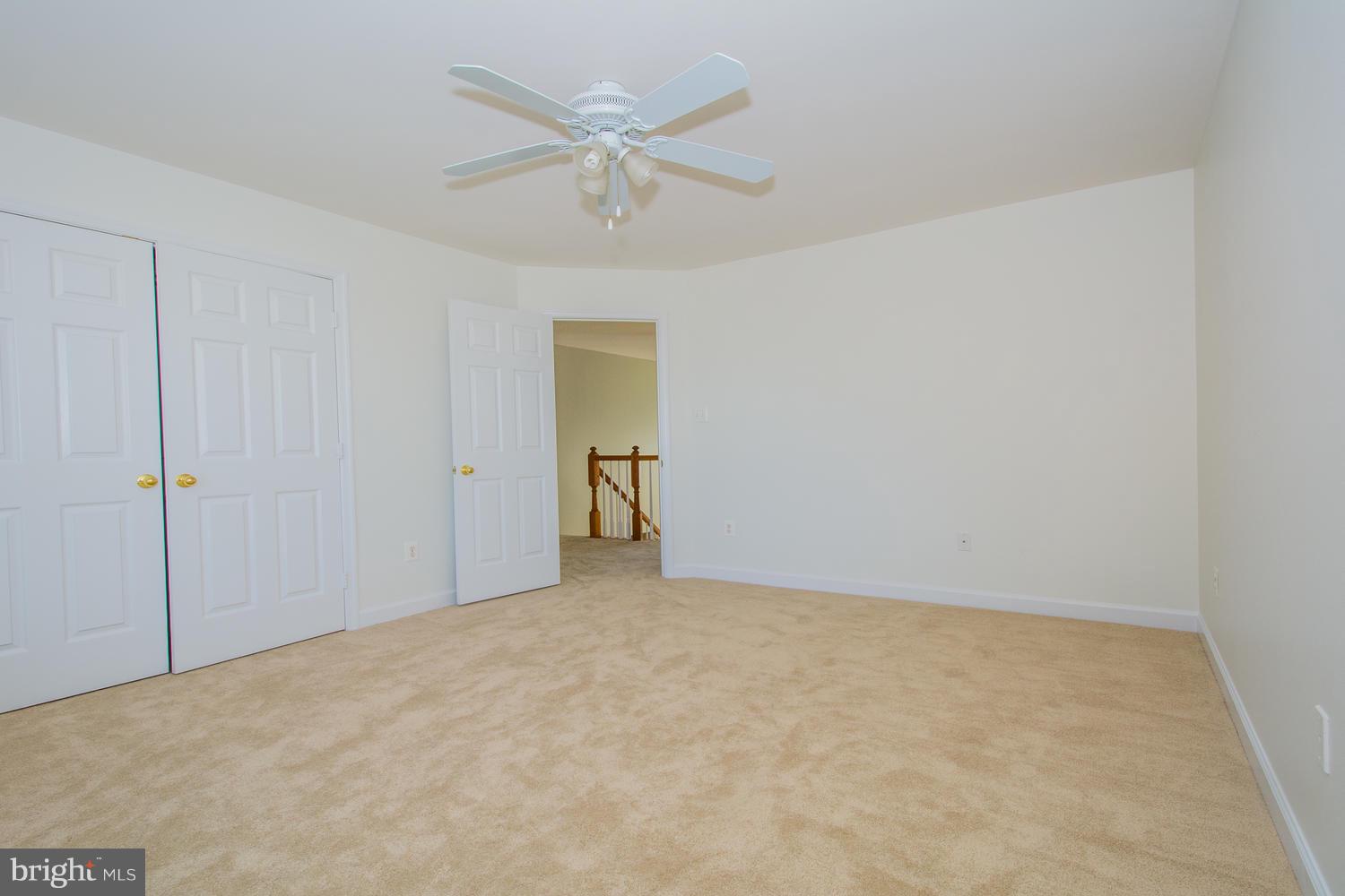 5986 Calvert Way Eldersburg, MD 21784 - Photo 30 of 40 a view of an empty room and chandelier fan