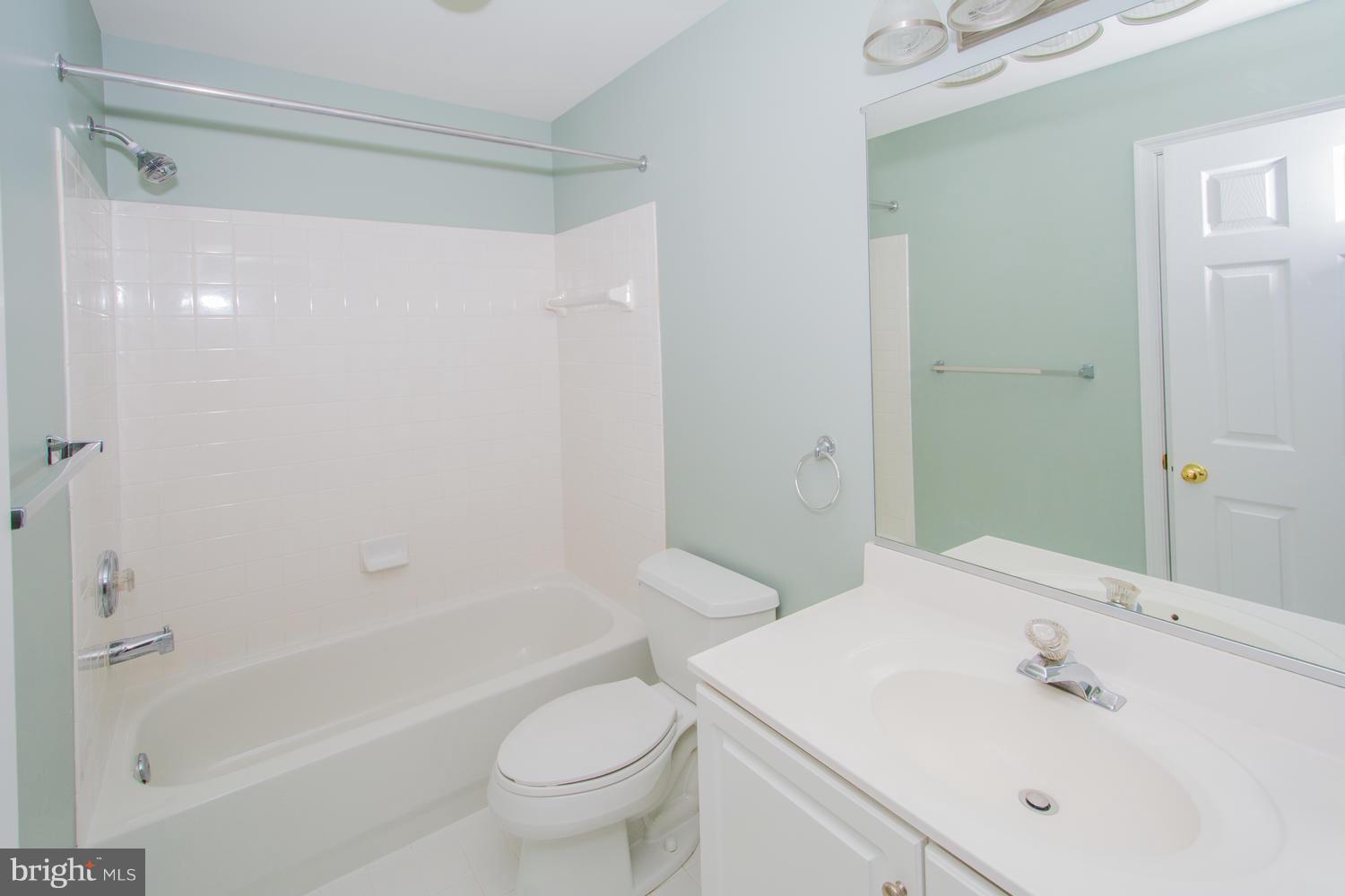 5986 Calvert Way Eldersburg, MD 21784 - Photo 32 of 40 a bathroom with a sink a toilet and shower