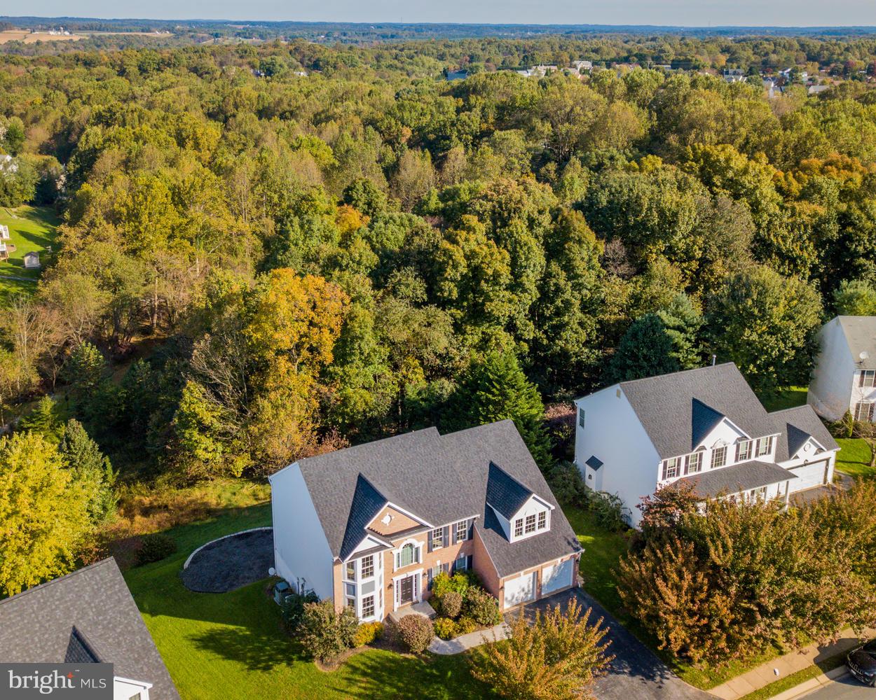 5986 Calvert Way Eldersburg, MD 21784 - Photo 38 of 40 an aerial view of a house with garden space and trees all around