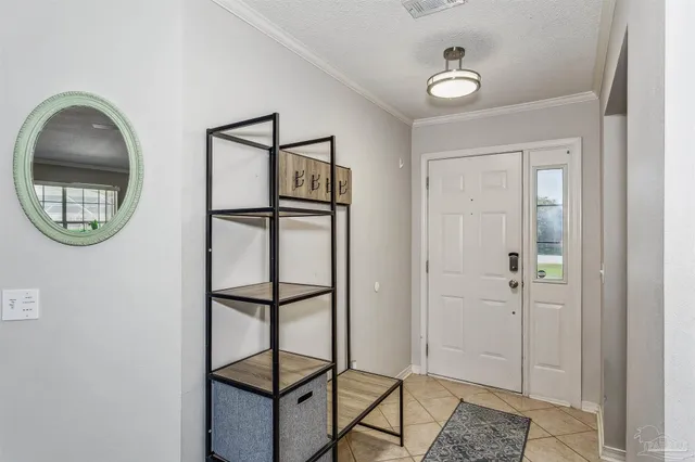 a view of a hallway with wooden floor and entryway