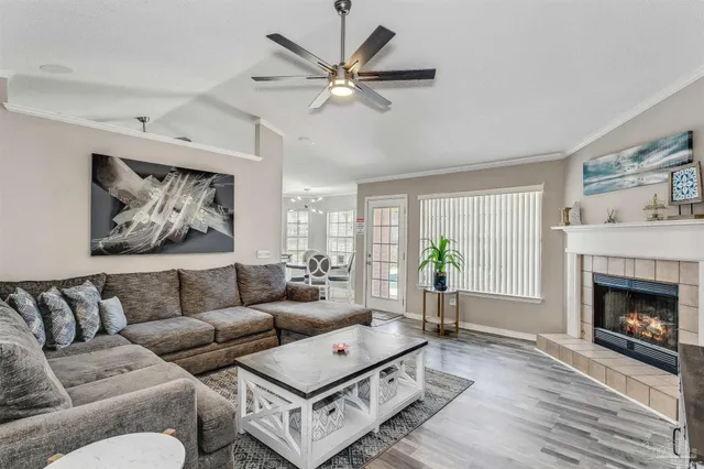 a living room with furniture and a fireplace