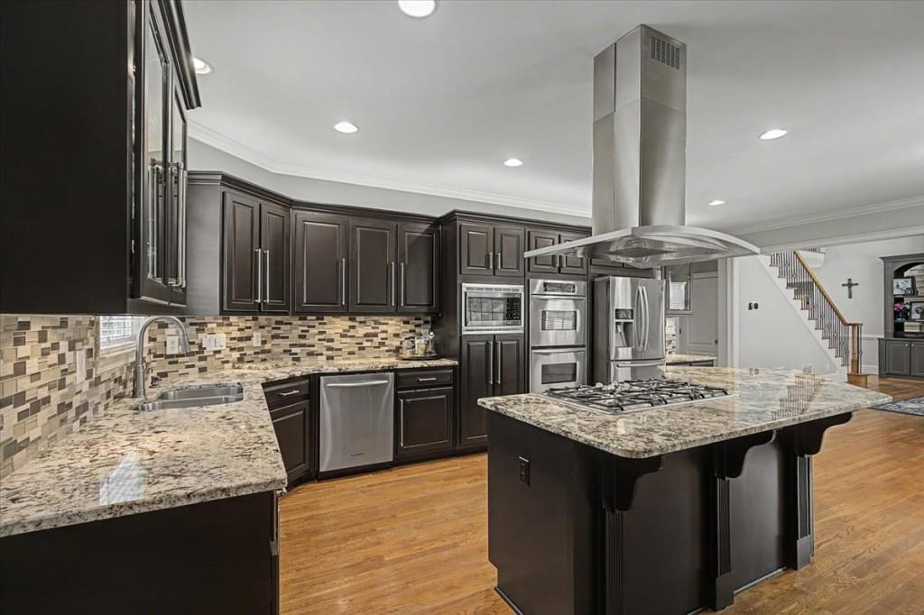 122 Ridge View Drive Ball Ground, GA 30107 - Photo 20 of 84 a kitchen with kitchen island granite countertop a sink cabinets and stainless steel appliances